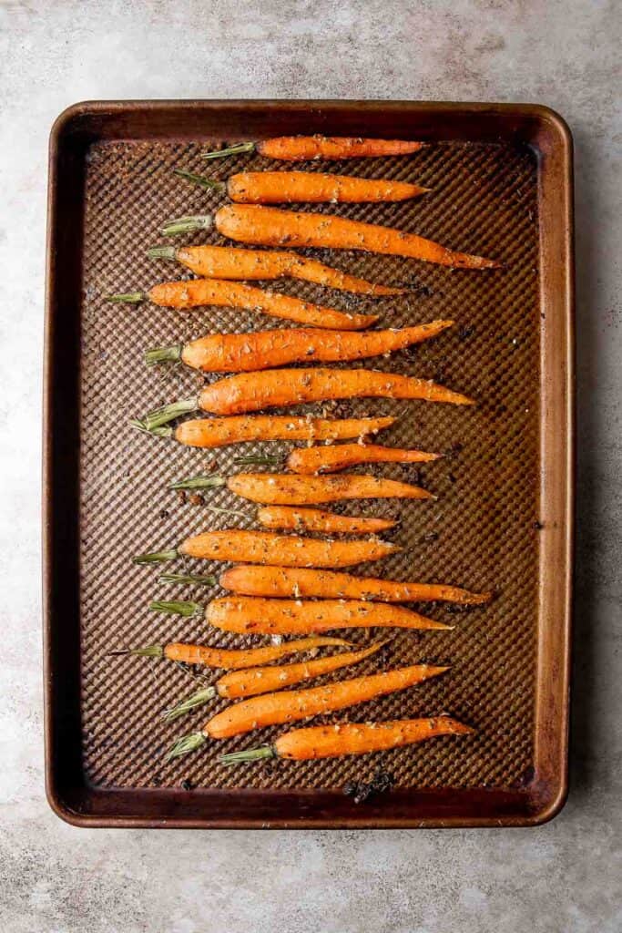 Garlic and herb roasted carrots are delicious and flavorful, easy to make, and the perfect vegan Easter side dish — or for any time of the year! | aheadofthyme.com