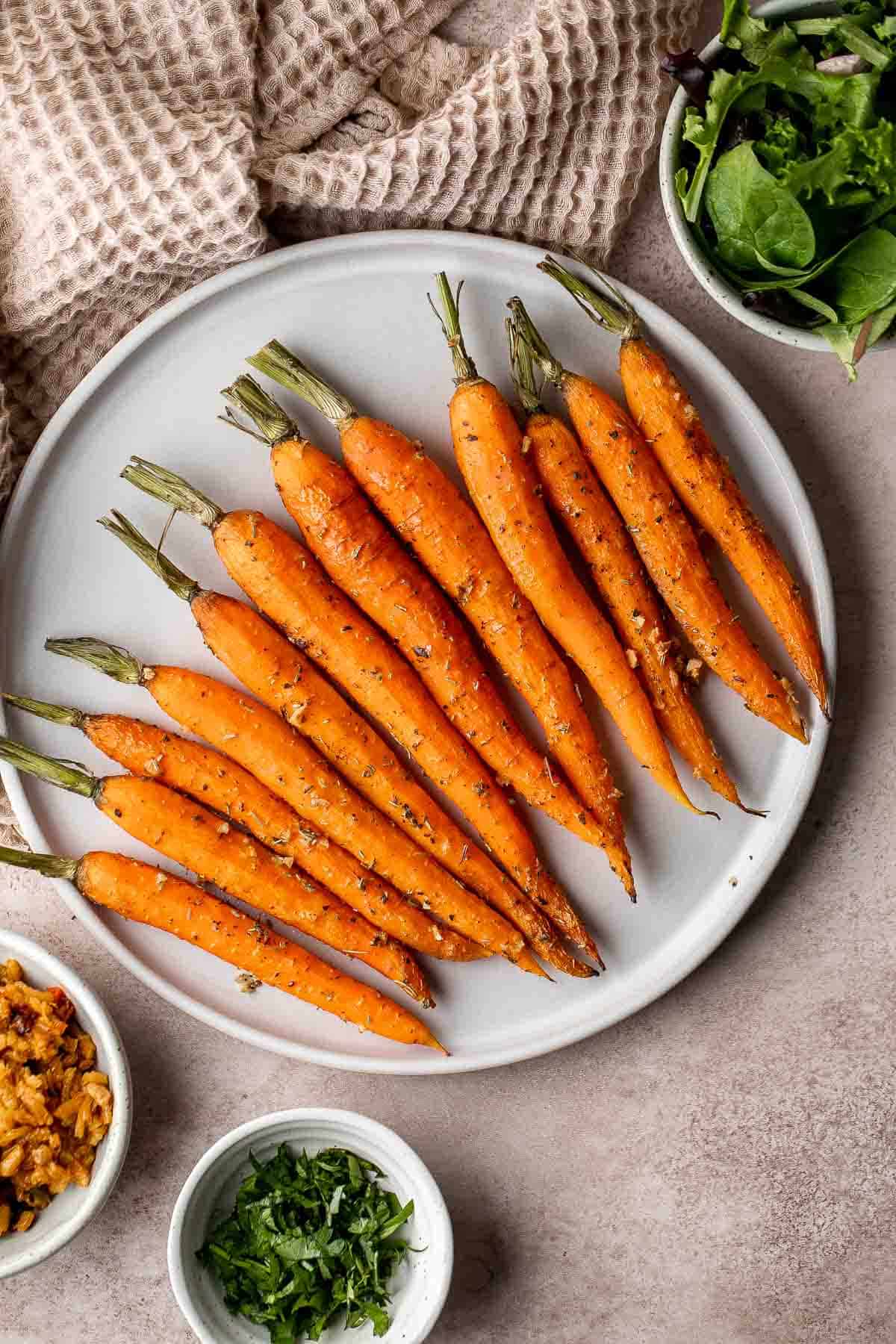 Garlic and herb roasted carrots are delicious and flavorful, easy to make, and the perfect vegan Easter side dish — or for any time of the year! | aheadofthyme.com