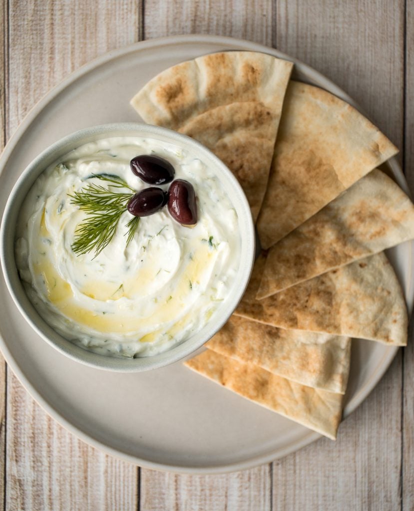 Light and fresh, easy tzatziki sauce is a creamy yogurt cucumber dip packed with fresh cucumbers, garlic, dill, lemon juice and olive oil. So easy to make. | aheadofthyme.com