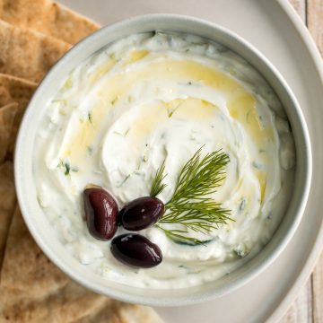 Light and fresh, easy tzatziki sauce is a creamy yogurt cucumber dip packed with fresh cucumbers, garlic, dill, lemon juice and olive oil. So easy to make. | aheadofthyme.com