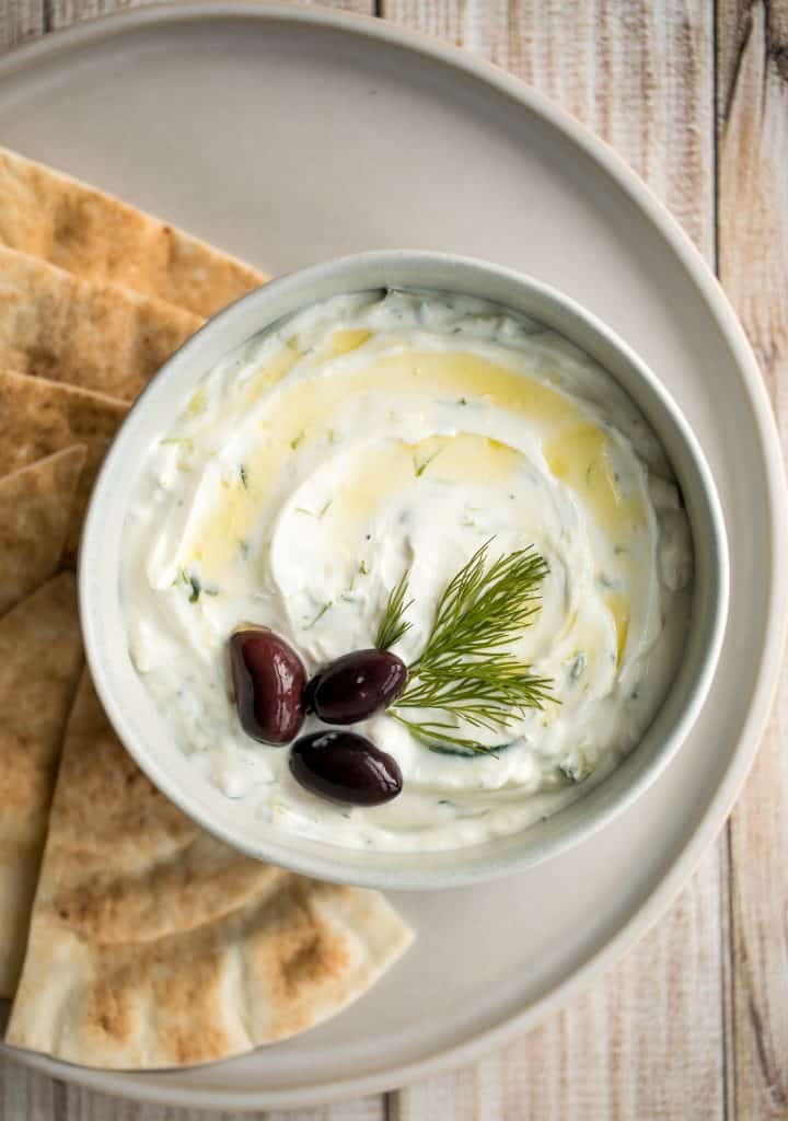 Light and fresh, easy tzatziki sauce is a creamy yogurt cucumber dip packed with fresh cucumbers, garlic, dill, lemon juice and olive oil. So easy to make. | aheadofthyme.com