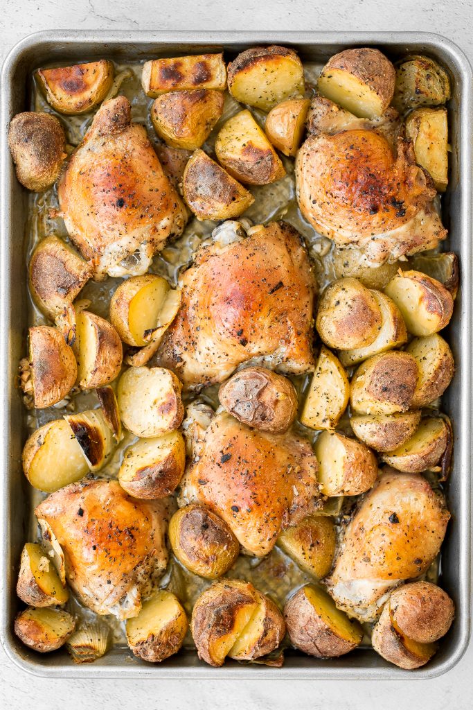 One pan garlic roasted chicken and baby potatoes is an easy to make, delicious, and wholesome meal for the entire family. Prep this sheet pan in 10 minutes. | aheadofthyme.com