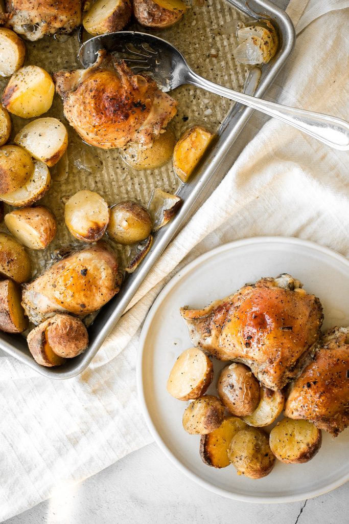 One pan garlic roasted chicken and baby potatoes is an easy to make, delicious, and wholesome meal for the entire family. Prep this sheet pan in 10 minutes. | aheadofthyme.com