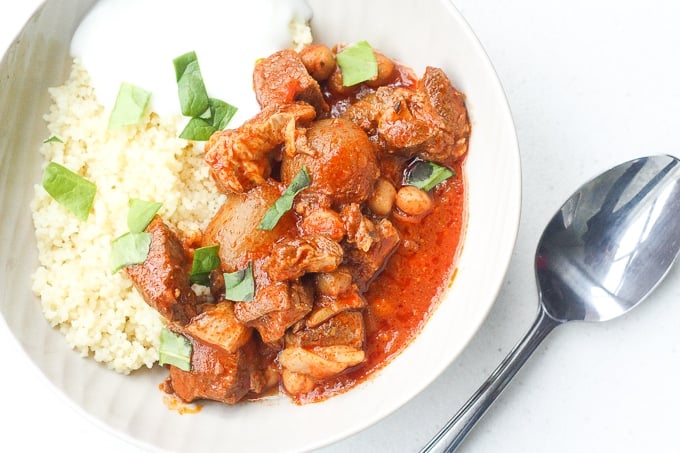 A bowl of flavourful and tender, juicy slow cooker Moroccan lamb stew served over a bowl of couscous is the ultimate Middle Eastern comfort food. | aheadofthyme.com