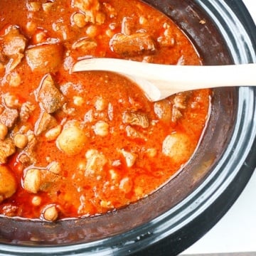 A bowl of flavourful and tender, juicy slow cooker Moroccan lamb stew served over a bowl of couscous is the ultimate Middle Eastern comfort food. | aheadofthyme.com