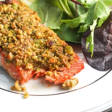 Pistachio-crusted salmon is a gourmet dinner without the gourmet skills! Prepare this with a handful of ingredients in less than 20 minutes! | aheadofthyme.com