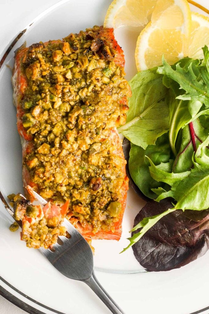 Pistachio-crusted salmon is a gourmet dinner without the gourmet skills! Prepare this with a handful of ingredients in less than 20 minutes! | aheadofthyme.com