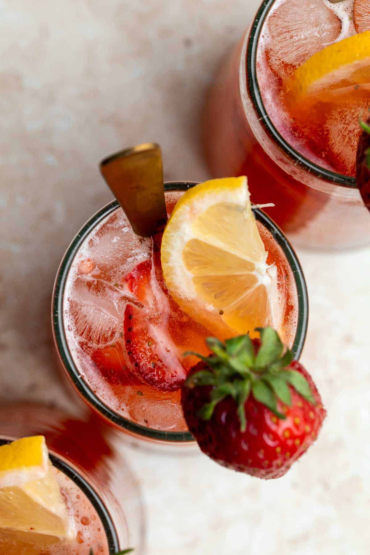 Homemade strawberry lemonade is refreshing, flavorful, and easy to make. This sparkling summer drink is loaded with fresh strawberries and lemon. | aheadofthyme.com