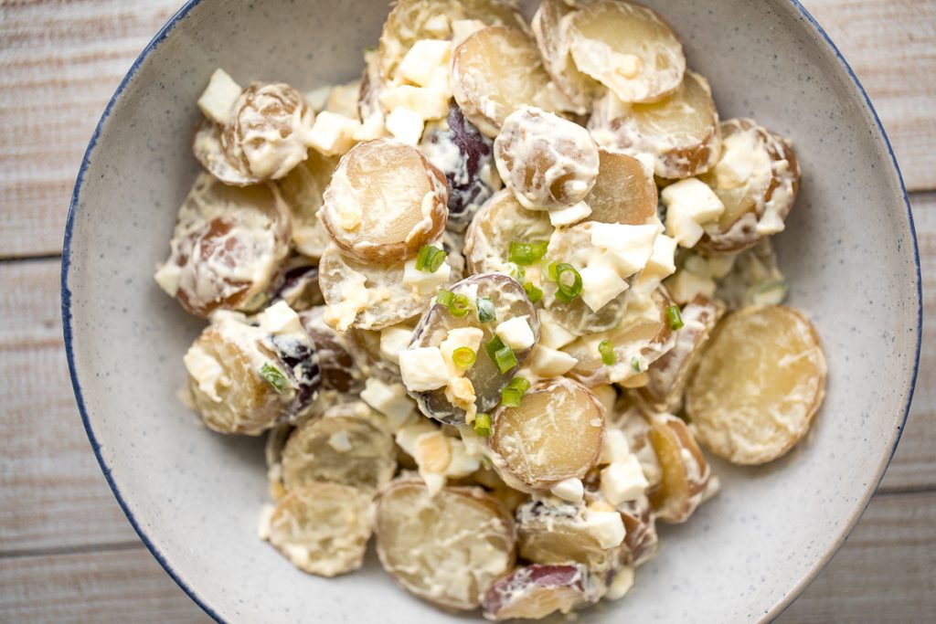 Easy homemade potato salad is loaded with baby potatoes, eggs, and green onions and tossed in a mayo sauce and is a go-to for summer barbecues and picnics. | aheadofthyme.com