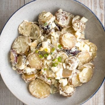 Easy homemade potato salad is loaded with baby potatoes, eggs, and green onions and tossed in a mayo sauce and is a go-to for summer barbecues and picnics. | aheadofthyme.com