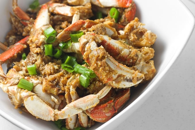 Ginger and scallion Dungeness crab is the ultimate Asian seafood experience stir-fried to perfection and coated with intense flavours. | aheadofthyme.com