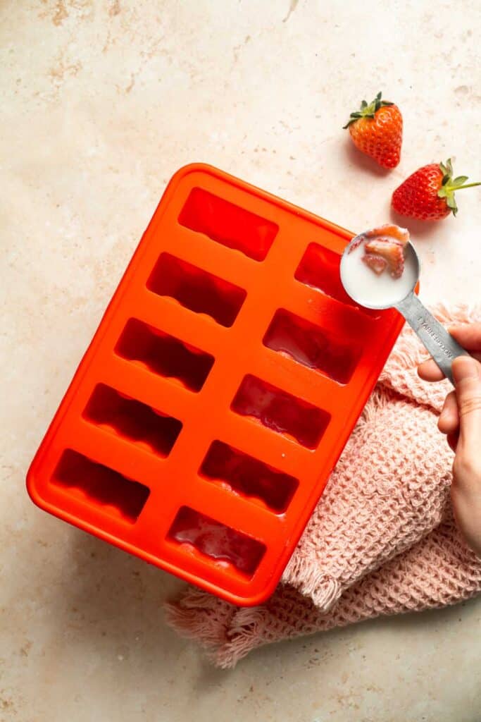 Homemade Strawberries and Cream Popsicles are healthy and easy to make using just four ingredients including fresh fruit. | aheadofthyme.com