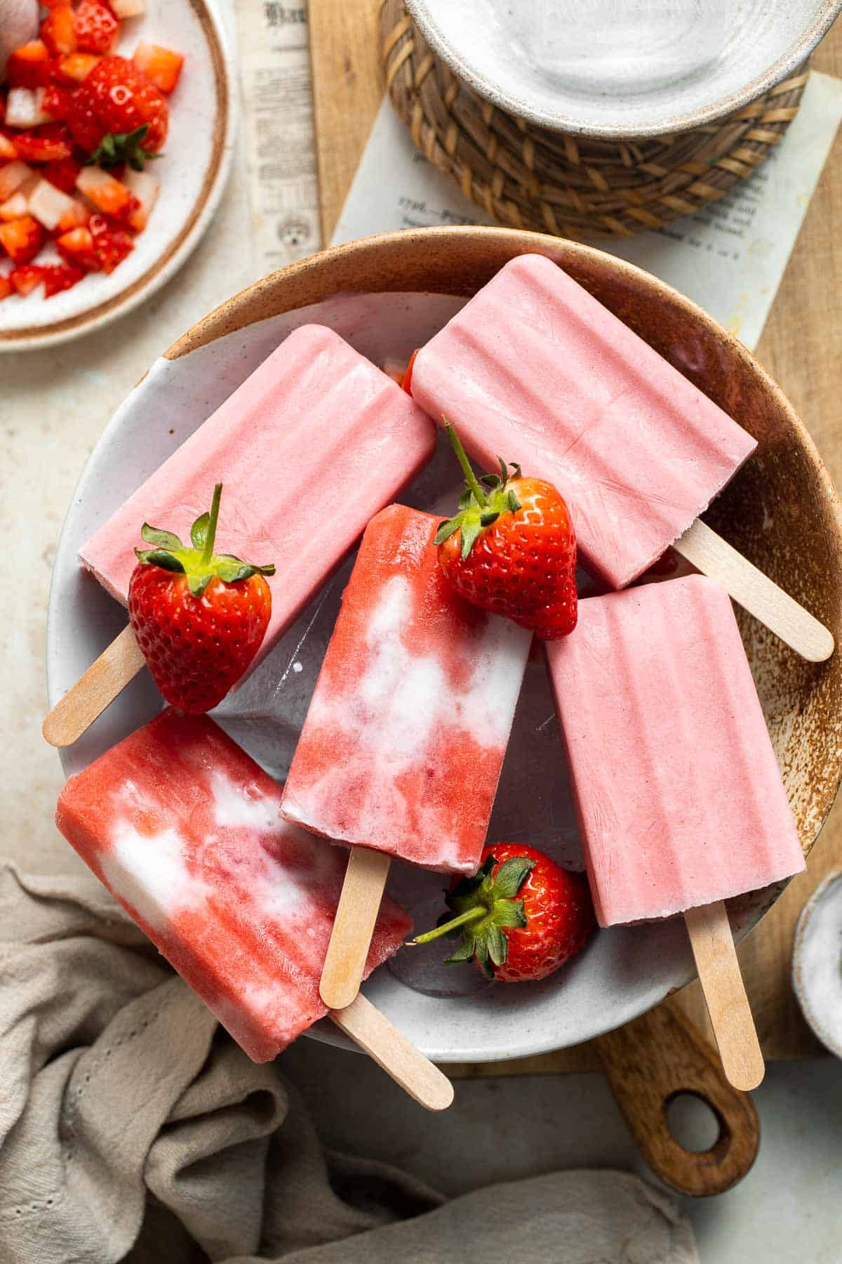 Homemade Strawberries and Cream Popsicles are healthy and easy to make using just four ingredients including fresh fruit. | aheadofthyme.com