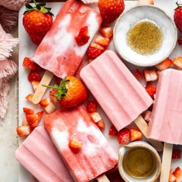 Homemade Strawberries and Cream Popsicles are healthy and easy to make using just four ingredients including fresh fruit. | aheadofthyme.com