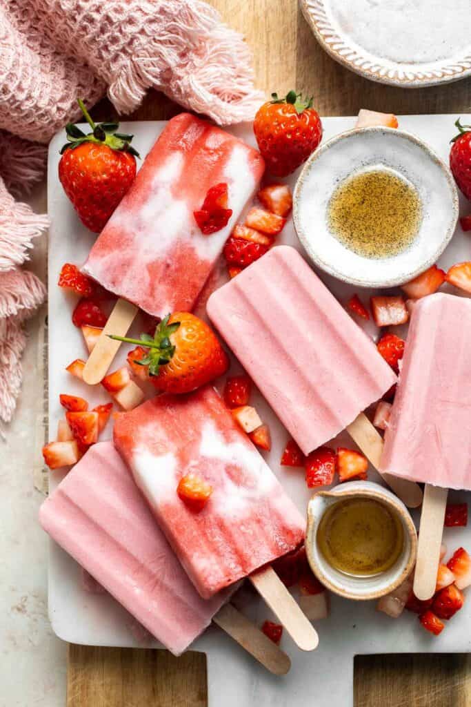 Homemade Strawberries and Cream Popsicles are healthy and easy to make using just four ingredients including fresh fruit. | aheadofthyme.com
