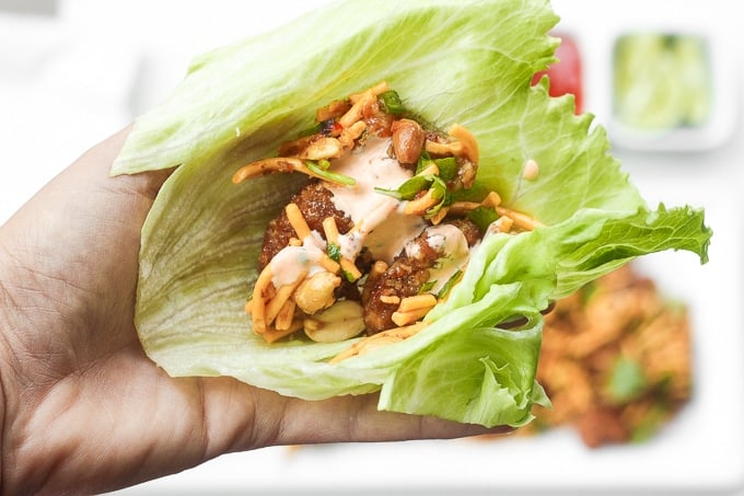 Spice it up and make copycat Szechuan chicken lettuce wraps with spicy mayo from the comfort of your own home with this easy to follow recipe. Plus, it is healthier than the original! | aheadofthyme.com