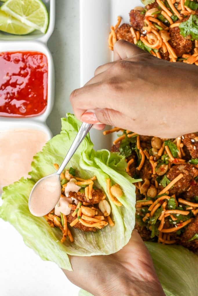 Spice it up and make copycat Szechuan chicken lettuce wraps with spicy mayo from the comfort of your own home with this easy to follow recipe. Plus, it is healthier than the original! | aheadofthyme.com