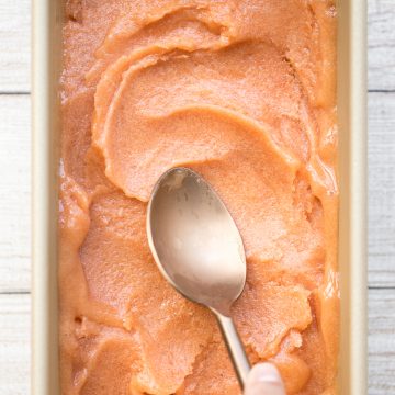 Smooth, sweet and refreshing 3-ingredient peach sorbet can be made with just a few minutes prep and without an ice cream maker! It's dairy-free and vegan. | aheadofthyme.com