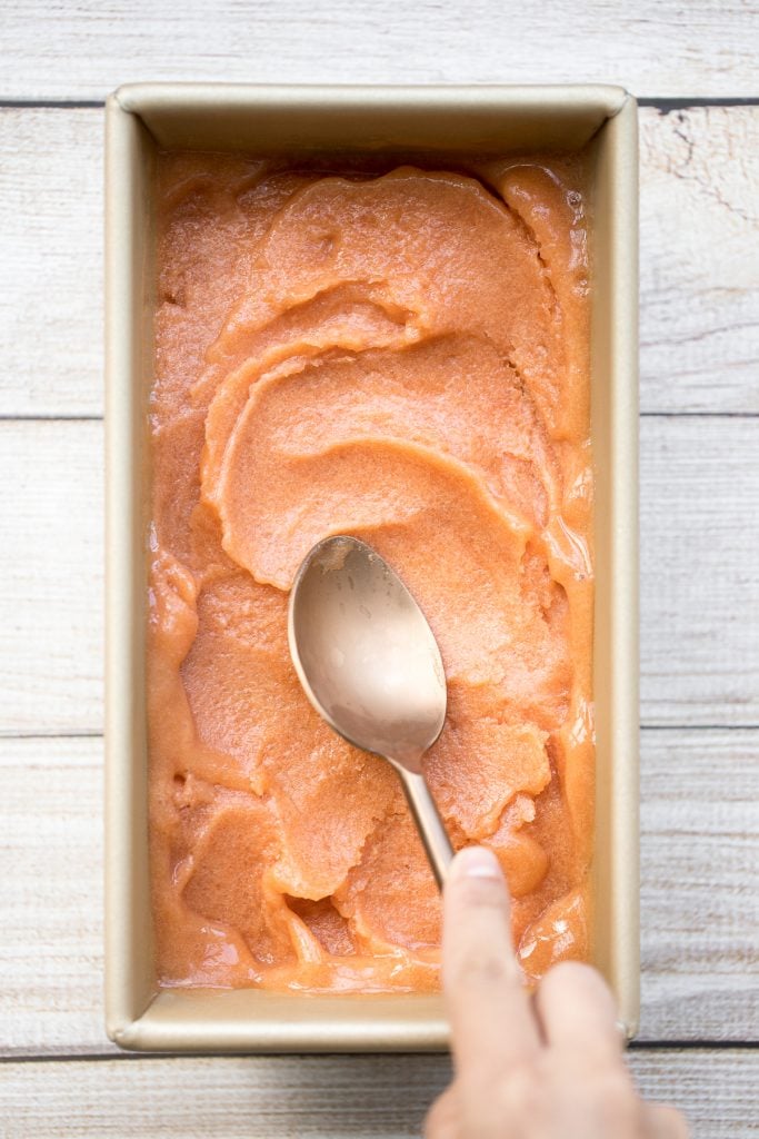 Smooth, sweet and refreshing 3-ingredient peach sorbet can be made with just a few minutes prep and without an ice cream maker! It's dairy-free and vegan. | aheadofthyme.com