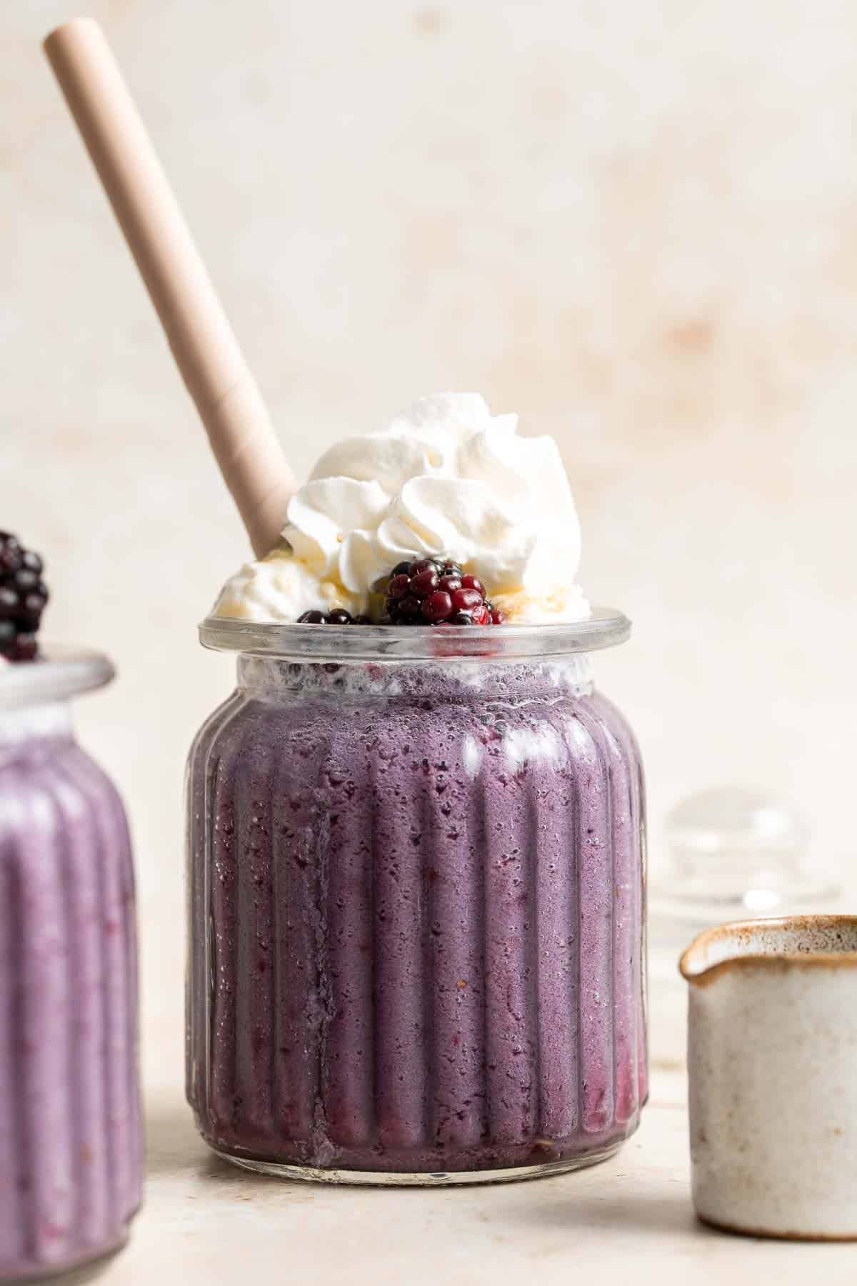 This blackberry milkshake is thick, creamy, and smooth. You won’t believe how quick and easy it is to make at home with 3 ingredients in under 5 minutes. | aheadofthyme.com
