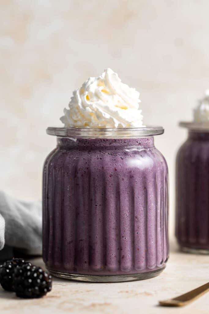 This blackberry milkshake is thick, creamy, and smooth. You won’t believe how quick and easy it is to make at home with 3 ingredients in under 5 minutes. | aheadofthyme.com