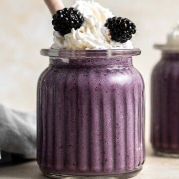 This blackberry milkshake is thick, creamy, and smooth. You won’t believe how quick and easy it is to make at home with 3 ingredients in under 5 minutes. | aheadofthyme.com