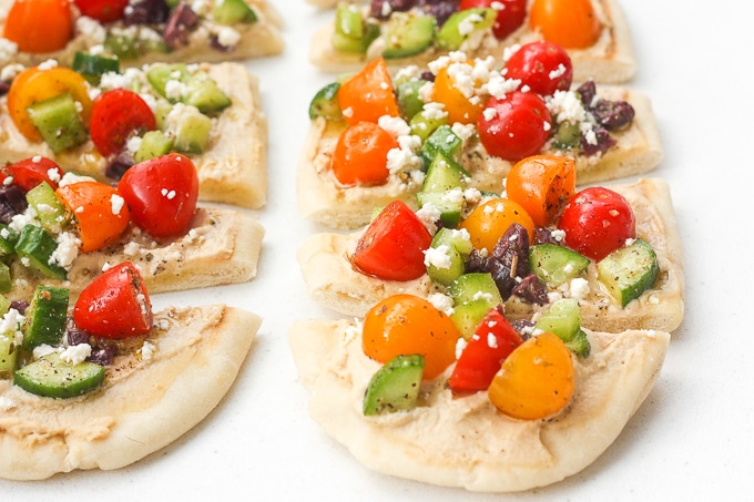 This bright and colourful Greek salad hummus flatbread is perfect as an appetizer or a healthy lunch or snack. | aheadofthyme.com