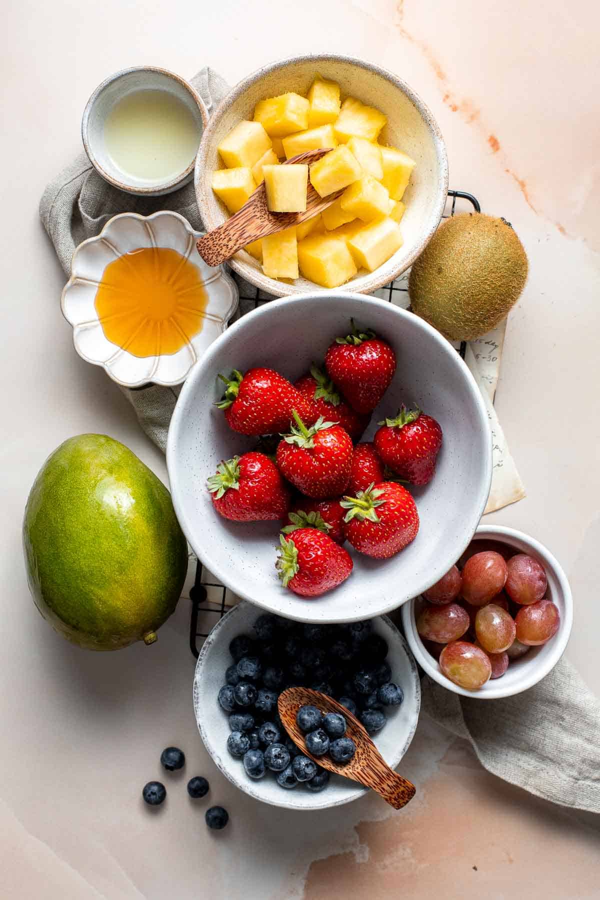 This Summer Fruit Salad is colorful, delicious, and naturally sweet (no processed sugar!). It's easy to make with fresh fruit tossed in a homemade dressing. | aheadofthyme.com