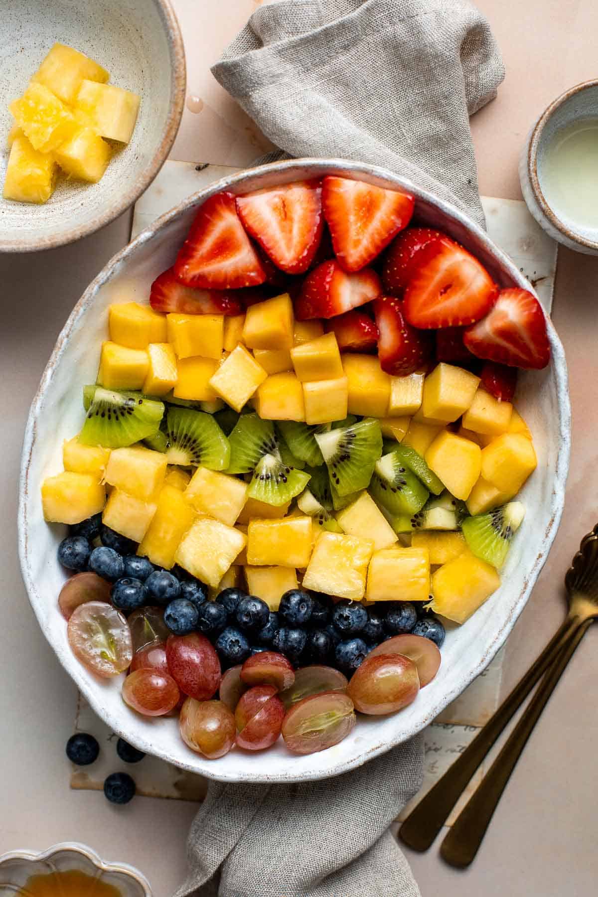 This Summer Fruit Salad is colorful, delicious, and naturally sweet (no processed sugar!). It's easy to make with fresh fruit tossed in a homemade dressing. | aheadofthyme.com