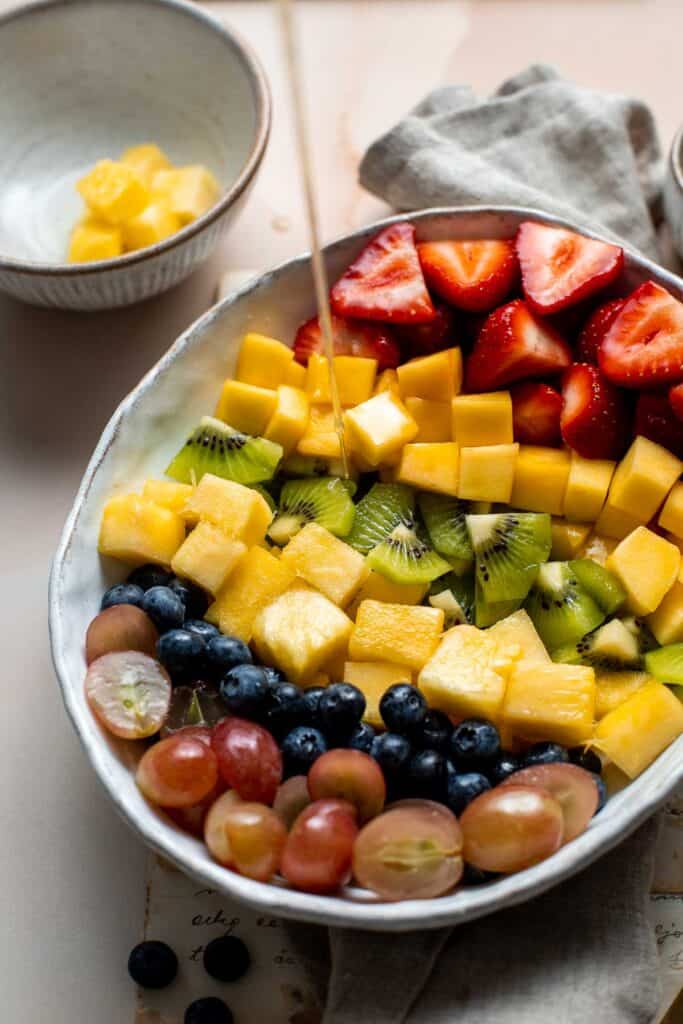 This Summer Fruit Salad is colorful, delicious, and naturally sweet (no processed sugar!). It's easy to make with fresh fruit tossed in a homemade dressing. | aheadofthyme.com