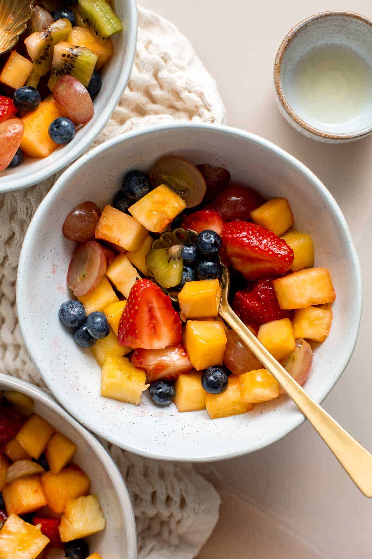 This Summer Fruit Salad is colorful, delicious, and naturally sweet (no processed sugar!). It's easy to make with fresh fruit tossed in a homemade dressing. | aheadofthyme.com