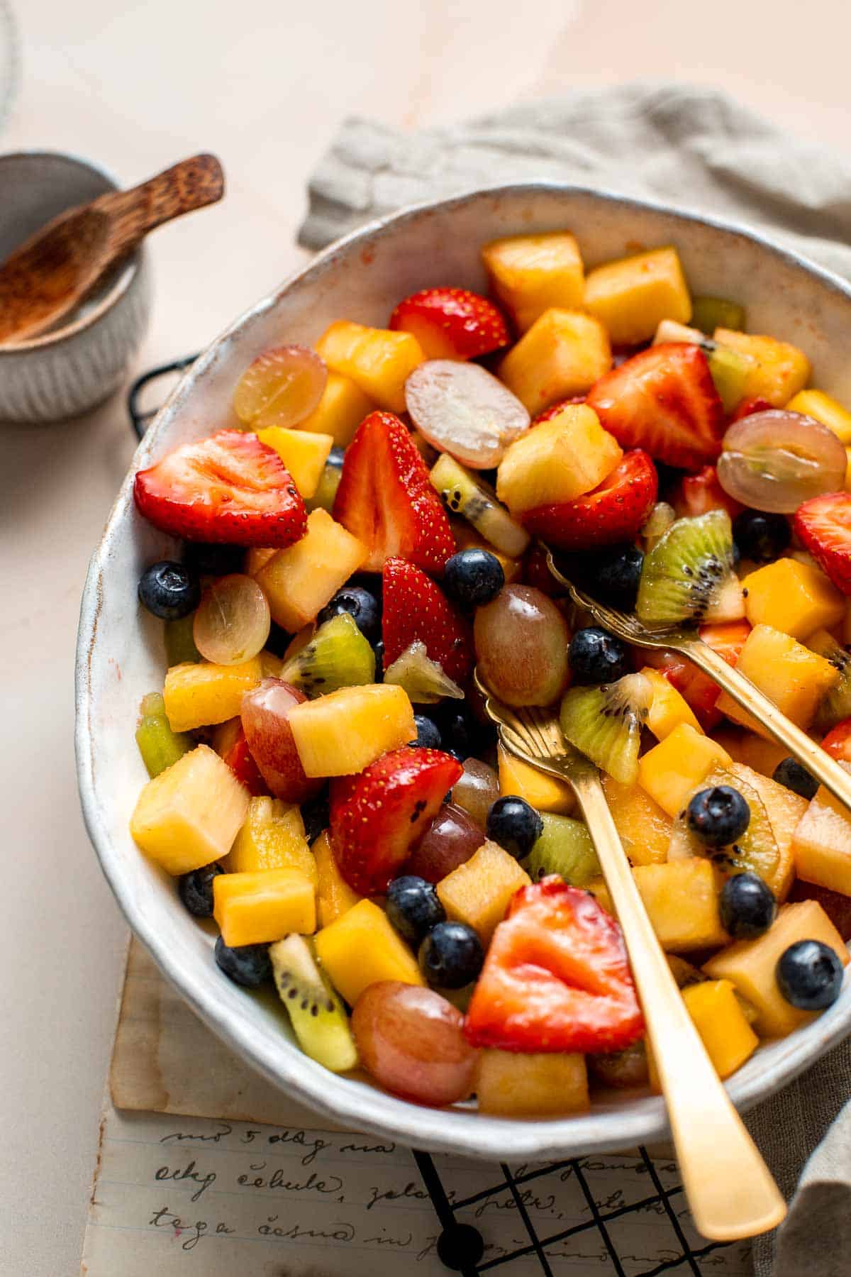 This Summer Fruit Salad is colorful, delicious, and naturally sweet (no processed sugar!). It's easy to make with fresh fruit tossed in a homemade dressing. | aheadofthyme.com