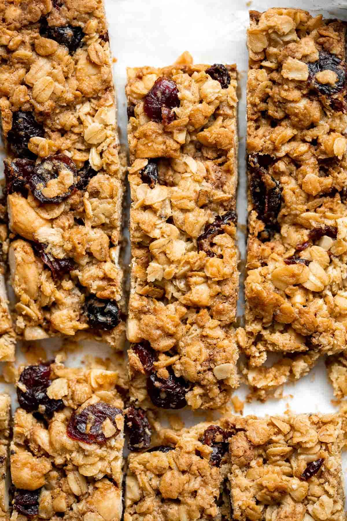 These almond cranberry chocolate chip granola bars are chewy and delicious, contain real dried fruit, and made healthier with less processed sugar. | aheadofthyme.com