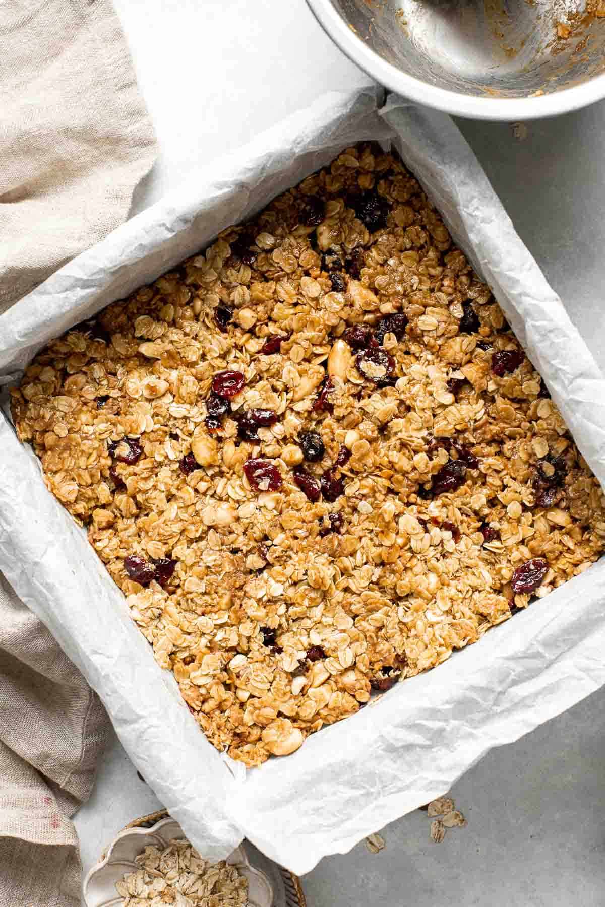 These almond cranberry chocolate chip granola bars are chewy and delicious, contain real dried fruit, and made healthier with less processed sugar. | aheadofthyme.com