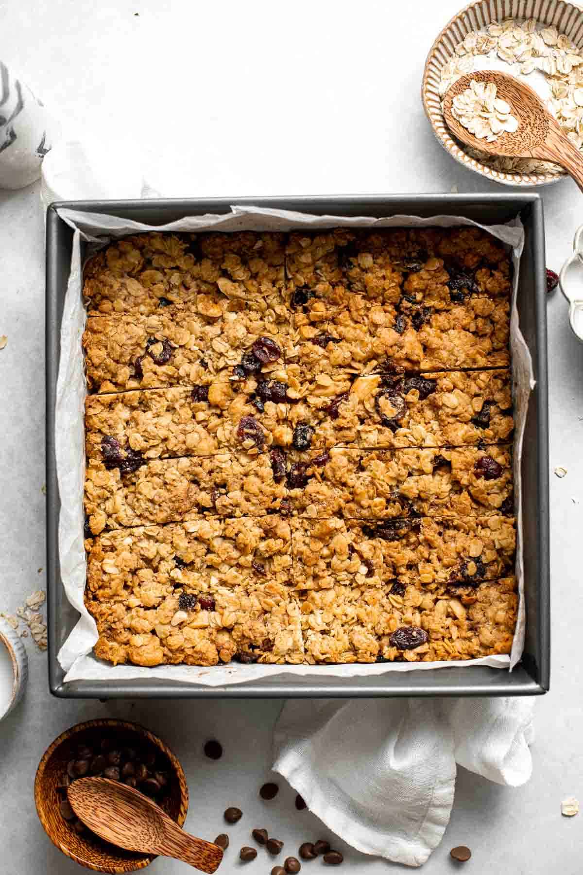 These almond cranberry chocolate chip granola bars are chewy and delicious, contain real dried fruit, and made healthier with less processed sugar. | aheadofthyme.com
