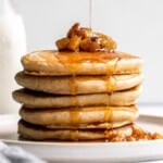 Soft fluffy applesauce pancakes is the best fall breakfast, loaded with leftover applesauce, hint of cinnamon, and a delicious caramel apple topping. | aheadofthyme.com