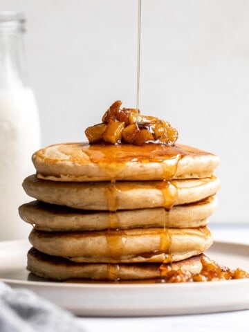 Soft fluffy applesauce pancakes is the best fall breakfast, loaded with leftover applesauce, hint of cinnamon, and a delicious caramel apple topping. | aheadofthyme.com