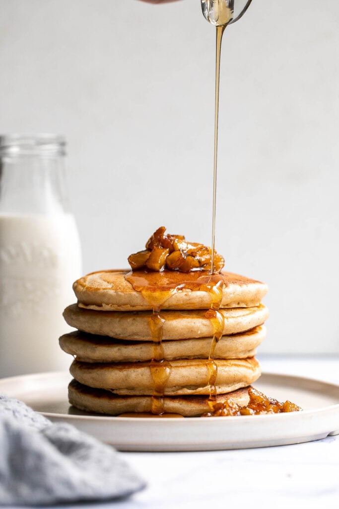 Soft fluffy applesauce pancakes is the best fall breakfast, loaded with leftover applesauce, hint of cinnamon, and a delicious caramel apple topping. | aheadofthyme.com