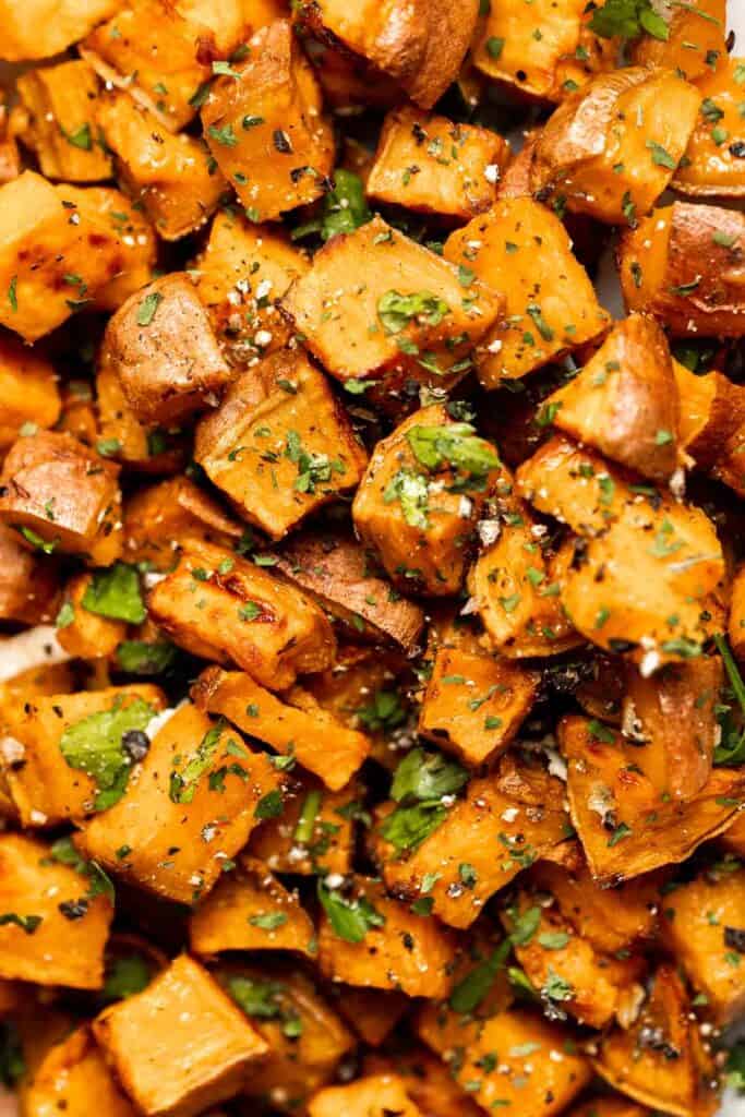 Herb Roasted Sweet Potatoes are a quick easy side dish that's healthy, delicious, and flavorful. A perfect side for your holiday table or weeknight dinner. | aheadofthyme.com