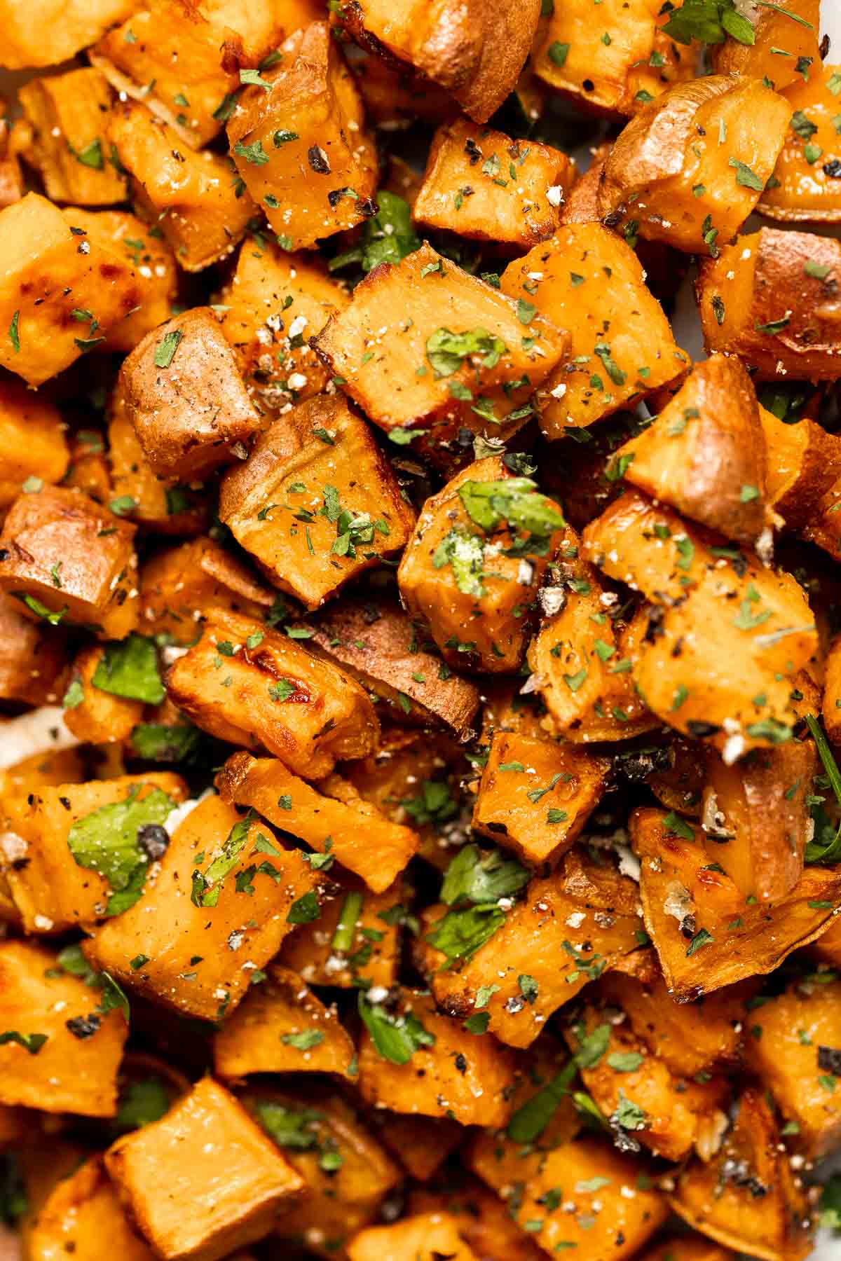 Herb Roasted Sweet Potatoes are a quick easy side dish that's healthy, delicious, and flavorful. A perfect side for your holiday table or weeknight dinner. | aheadofthyme.com