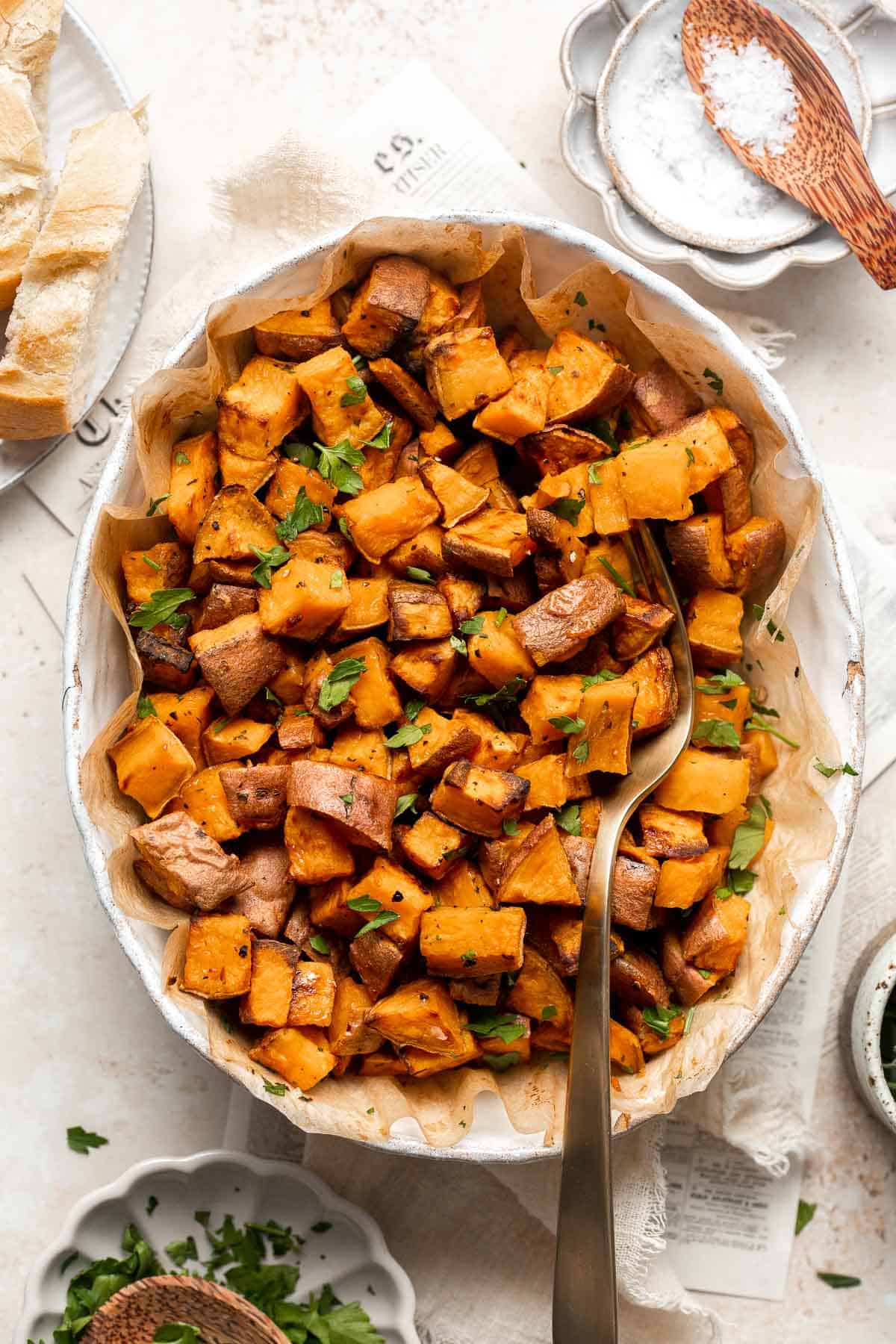 Herb Roasted Sweet Potatoes are a quick easy side dish that's healthy, delicious, and flavorful. A perfect side for your holiday table or weeknight dinner. | aheadofthyme.com