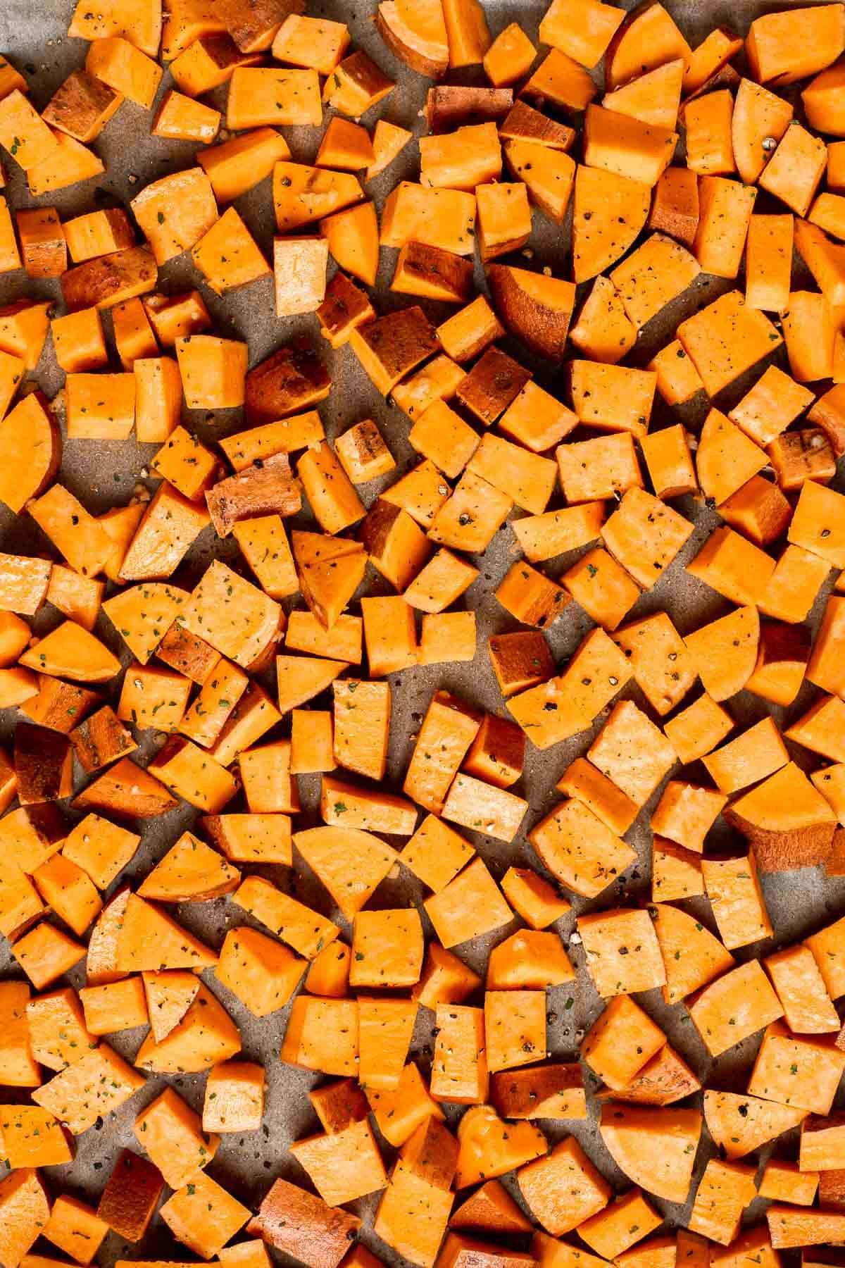 Herb Roasted Sweet Potatoes are a quick easy side dish that's healthy, delicious, and flavorful. A perfect side for your holiday table or weeknight dinner. | aheadofthyme.com