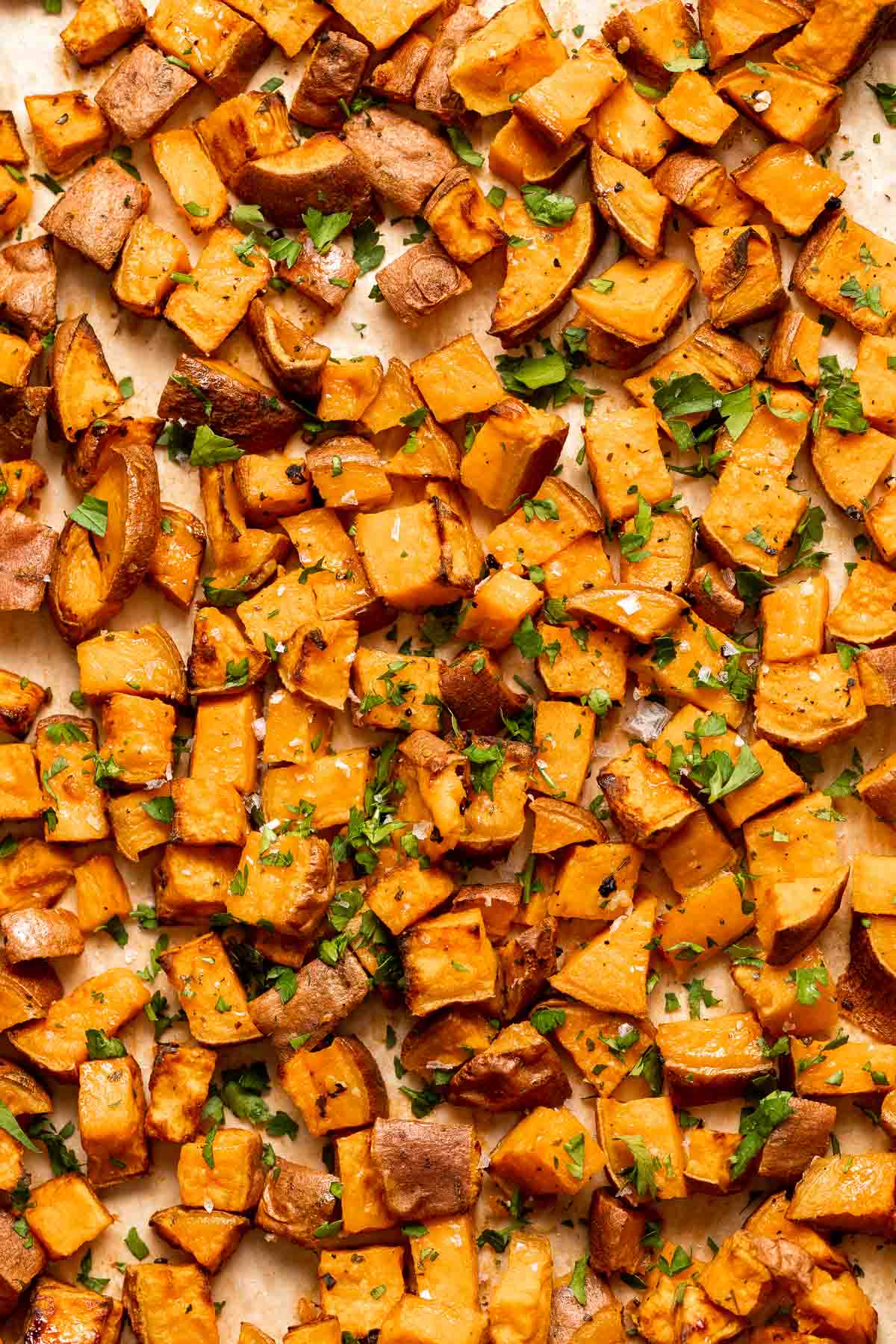 Herb Roasted Sweet Potatoes are a quick easy side dish that's healthy, delicious, and flavorful. A perfect side for your holiday table or weeknight dinner. | aheadofthyme.com