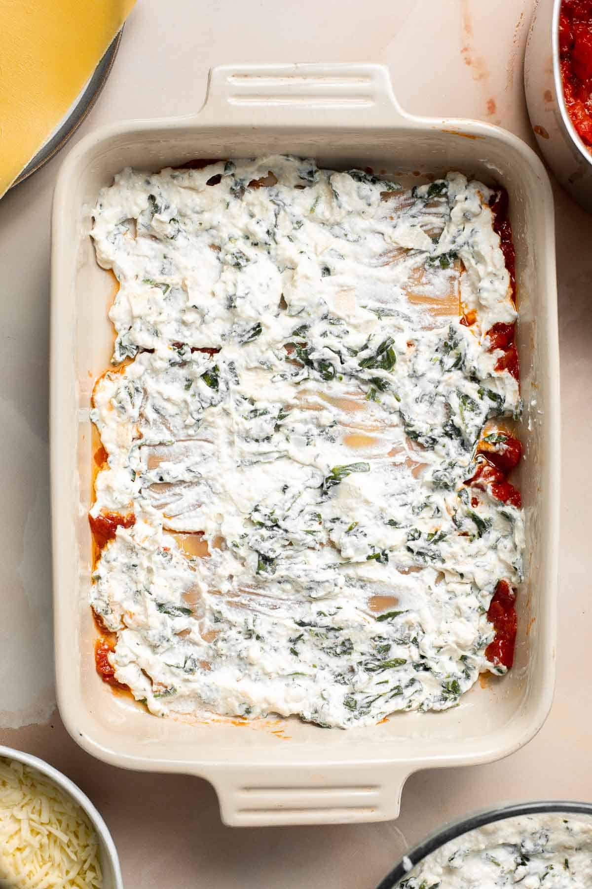 This Vegetarian Lasagna with Spinach is creamy, cheesy, and delicious. This classic Italian dish gets a meatless upgrade in this vegetarian version. | aheadofthyme.com