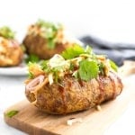 Try this gorgeous combination of BBQ chicken, scallions, cilantro and gruyere for an explosion of flavour in loaded BBQ chicken stuffed baked potatoes! | aheadofthyme.com