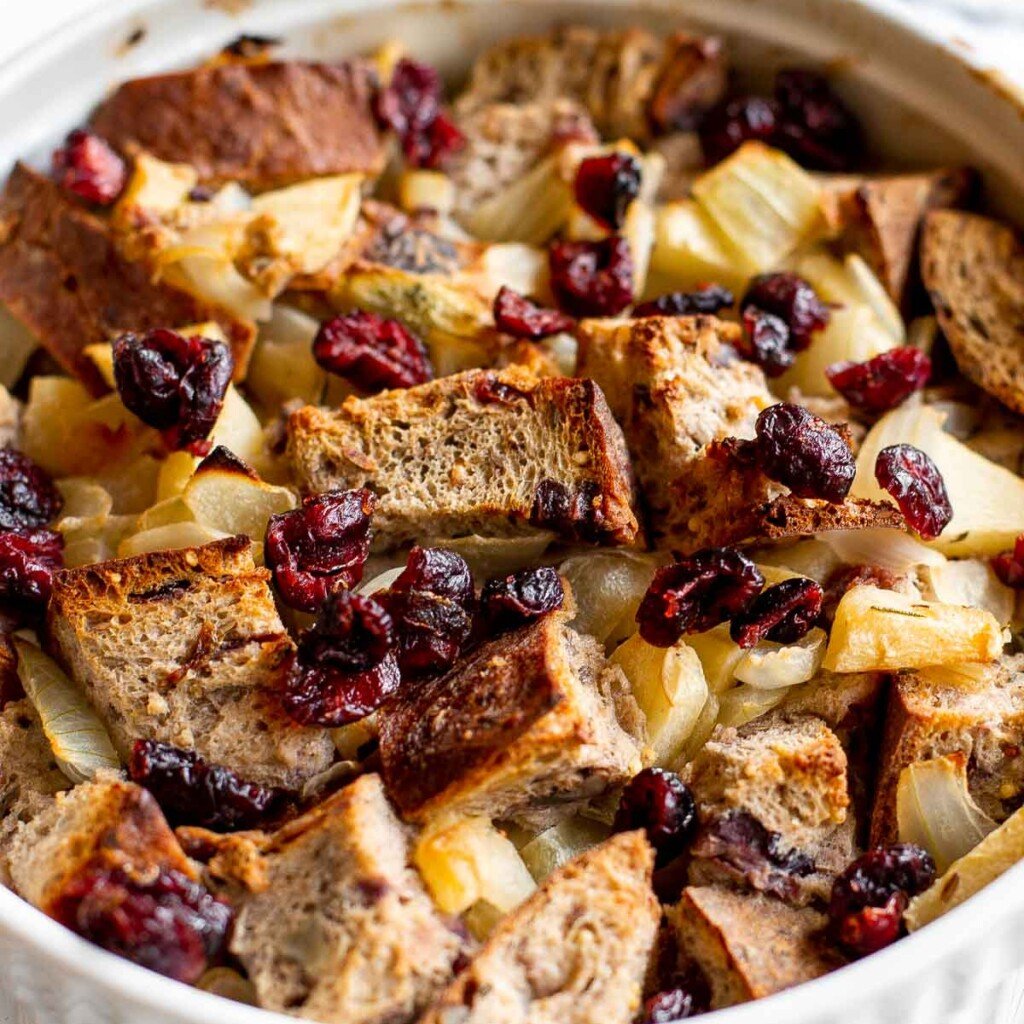Cranberry Apple Walnut Stuffing is a cozy holiday side with apples, cranberries, herbs, and toasted bread baked until golden and delicious. | aheadofthyme.com