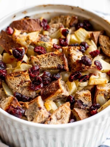 Cranberry Apple Walnut Stuffing is a cozy holiday side with apples, cranberries, herbs, and toasted bread baked until golden and delicious. | aheadofthyme.com
