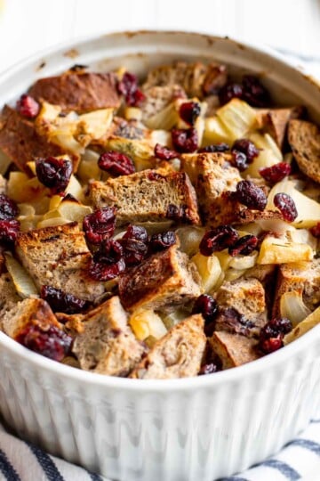 Cranberry Apple Walnut Stuffing is a cozy holiday side with apples, cranberries, herbs, and toasted bread baked until golden and delicious. | aheadofthyme.com
