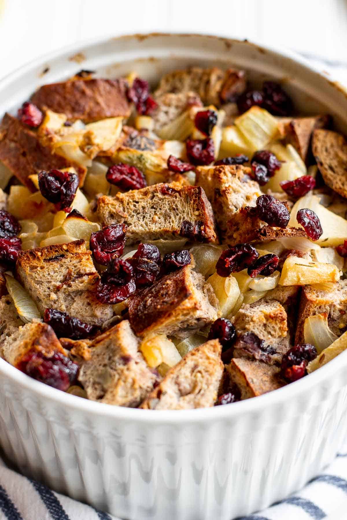 Cranberry Apple Walnut Stuffing is a cozy holiday side with apples, cranberries, herbs, and toasted bread baked until golden and delicious. | aheadofthyme.com