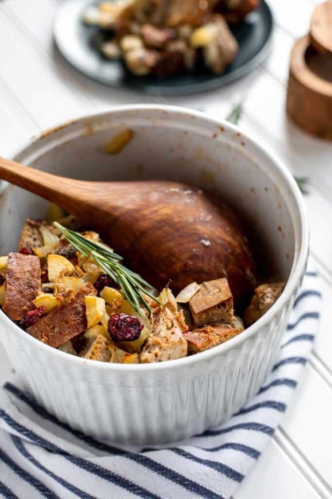 Cranberry Apple Walnut Stuffing is a cozy holiday side with apples, cranberries, herbs, and toasted bread baked until golden and delicious. | aheadofthyme.com